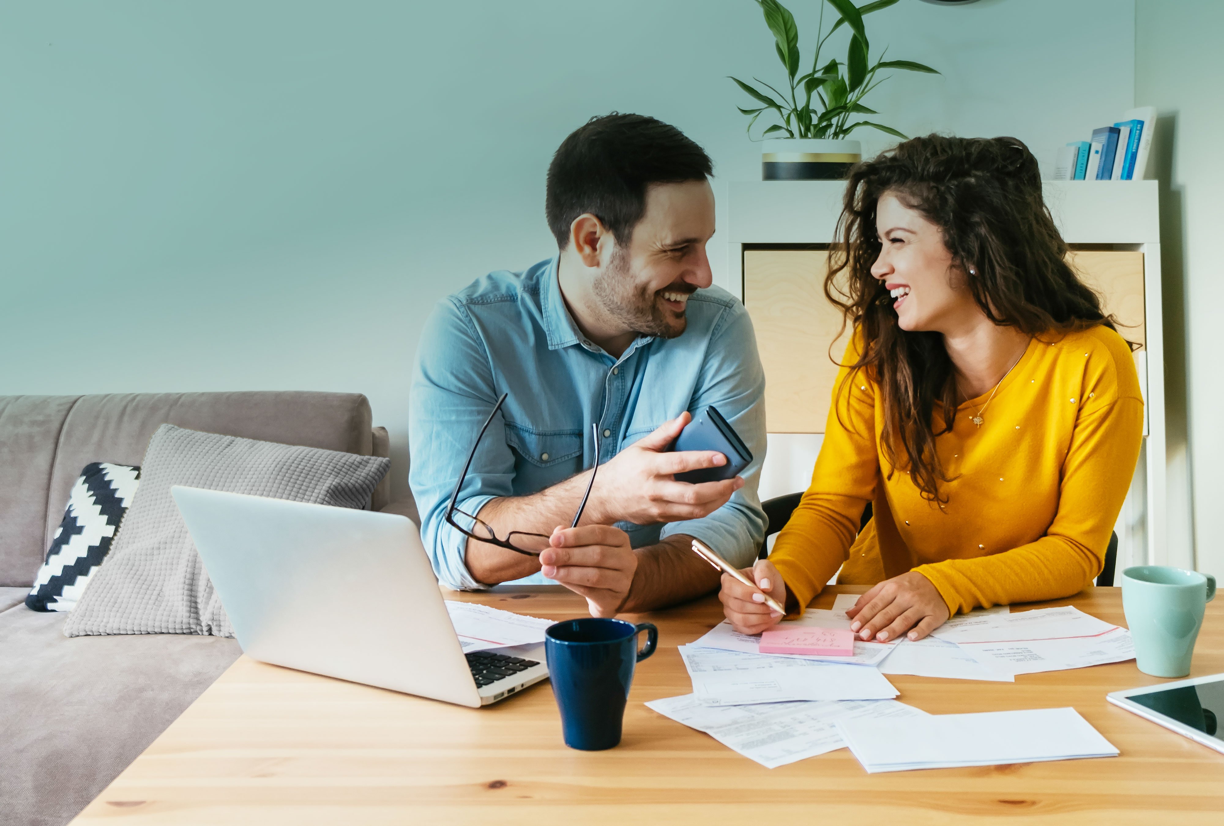 Young-couple-discuss-bills-home